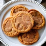 Chewy brown butter pumpkin cookies on a baking sheet.