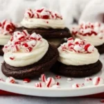 Peppermint frosted chocolate cookies on a festive plate