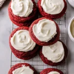 Delicious red velvet cookies on a plate with cream cheese frosting